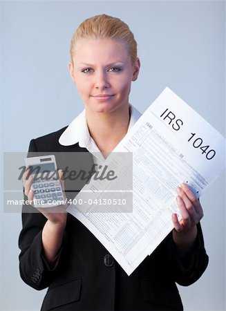 Business woman looking at filling in tax returns