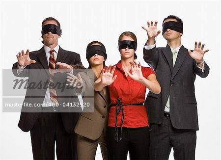 Business people in blindfolds