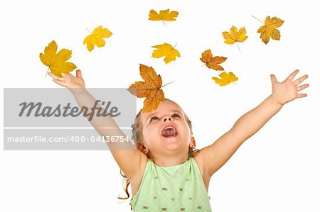 Happy shouting little girl welcoming the falling autumn leaves - isolated, without motion blur