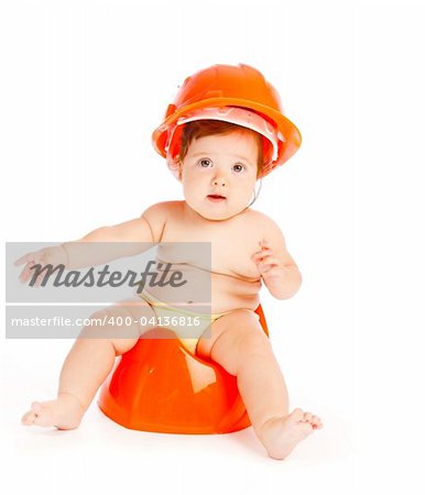 Baby in hardhat sitting on the potty