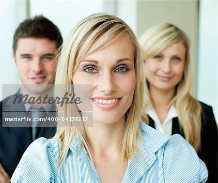 Portrait of a beautiful businesswoman in front of her team