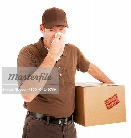 Delivery man suffering with a cold or flu on the job.  Isolated on white.