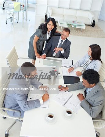 Multi-ethnic young businessteam working in a project in a meeting