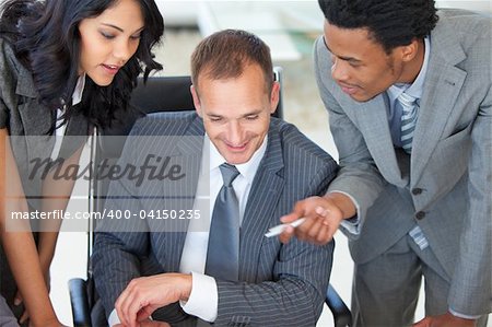 High angle of a manager with employees working in office