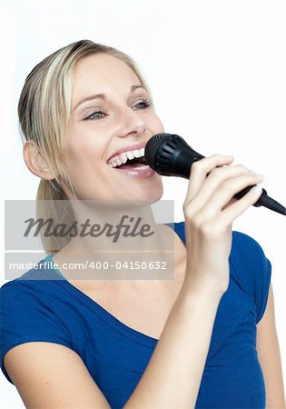 Beautiful woman singing on a microphone