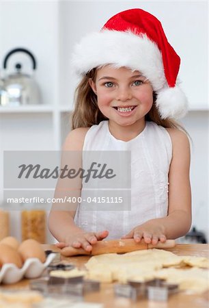 Happy family baking in kitchen Christmas cakes in the kitchen