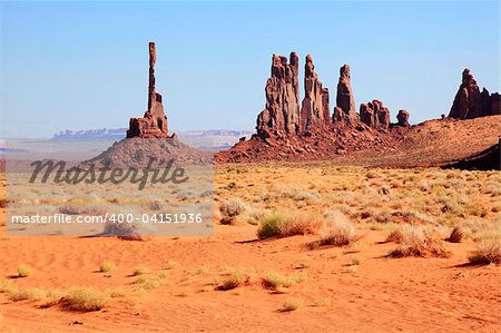 The Totem Pole and Yei Bi Chei rock formations in Monument Valley.