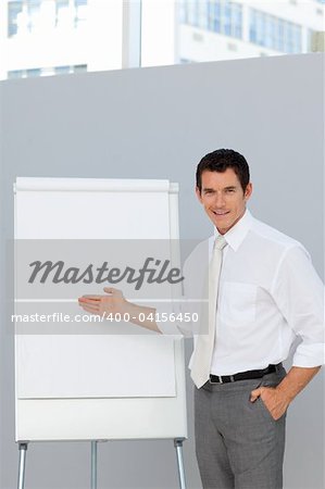 Attractive businessman giving a presentation in the office