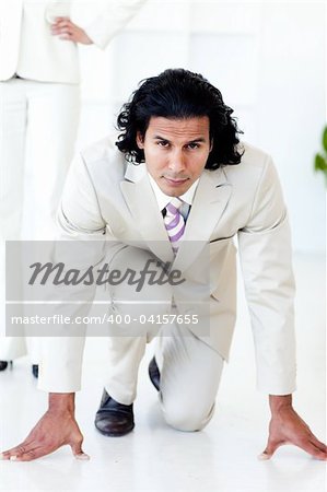 Portrait of an attractive businessman on his marks against white background