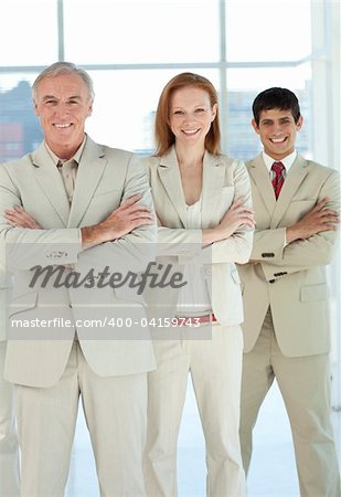 Business team with folded arms standing in a line