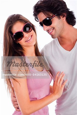 beautiful young couple embracing each other playfully on isolated white background