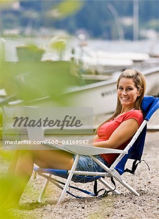 Woman using laptop on beach