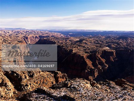 River flowing through a canyon surrounded by a rocky landscape. Horizontal shot.