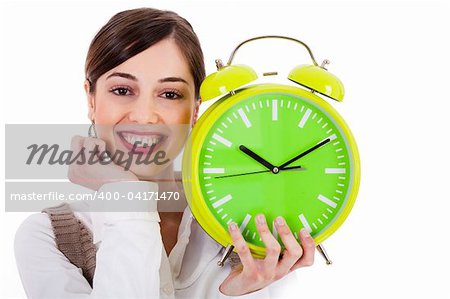 attractive young model smiling and holding the clock on white background