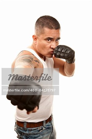 Hispanic man in t-shirt wearing mixed martial arts gloves