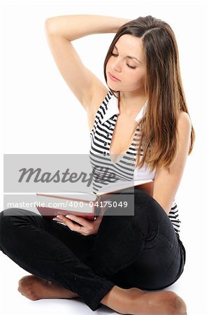 Beautiful  girl doing homework on a white background