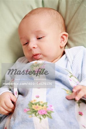 Portrait of adorable baby lying in bed