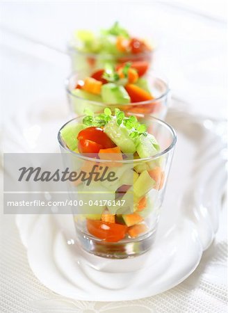 Three small vegetable salads served in glass for catering