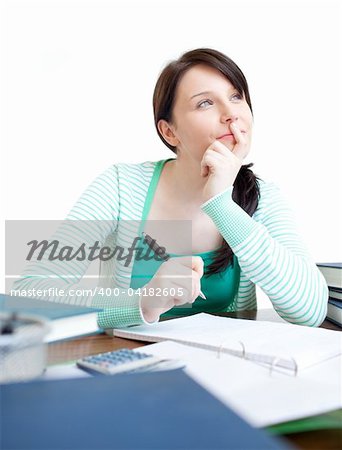 Confident teen girl studying at her desk at home