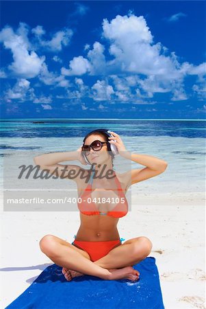 Beautiful woman resting near water at Maldives