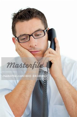 Young businessman sleeping on phone against a white background