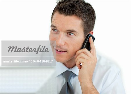 Businessman on phone working at a computer isolated on a white background