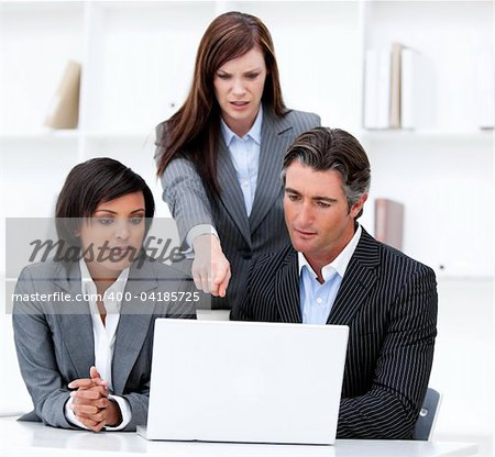 International business team working at a computer in the office