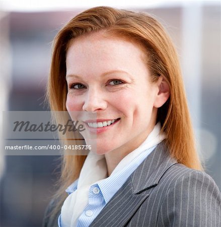 Confident business woman looking at the camera in the company