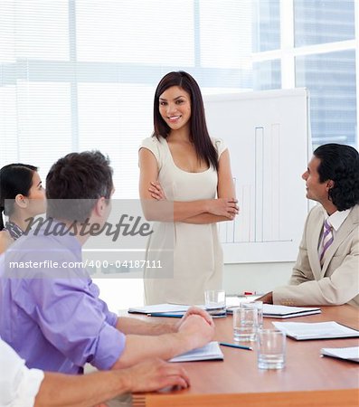 Young businesswoman giving a presentation to her team