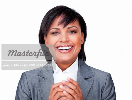 Hispanic businesswoman holding a coffee smiling at the camera