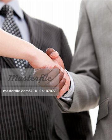 Close-up of a handshake between two businesspeople in the office