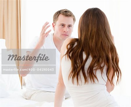 Stressful couple argumenting against a white background