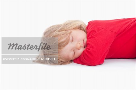 boy with long blond hair lying down sleeping - isolated on white