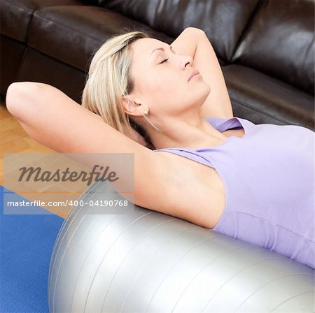 Beautiful woman doing exercice at home