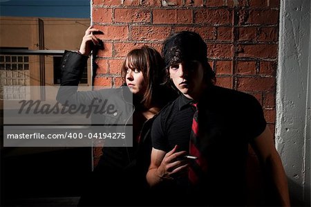 Sketchy Couple in a Brick Warehouse Near Window