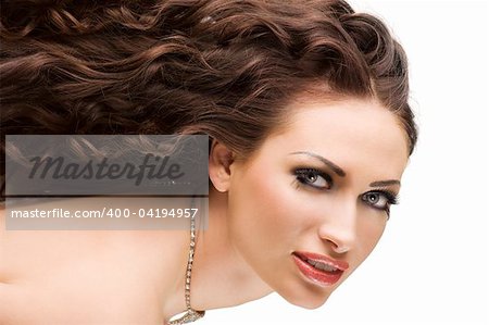 Portrait of a beautiful brunette woman with hairstyle and creative makeup
