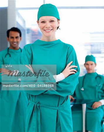 Confident surgeons smiling at the camera in a hospital