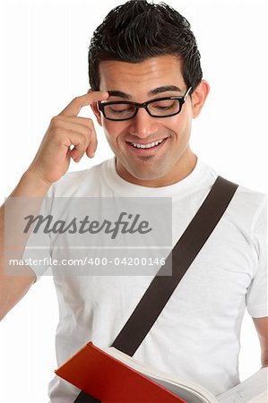 Smiling university or college student or young man reading a book.  White background.