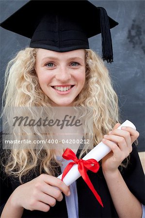 Portrait of a smiling teenage Girl Celebrating Graduation in the class