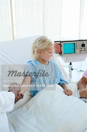 Afraid child patient receiving an injection in a hospital Afraid child patient receiving an injection in a hospital