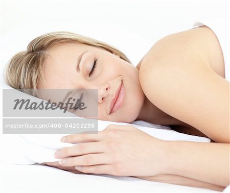 Radiant woman sleeping on her bed at home