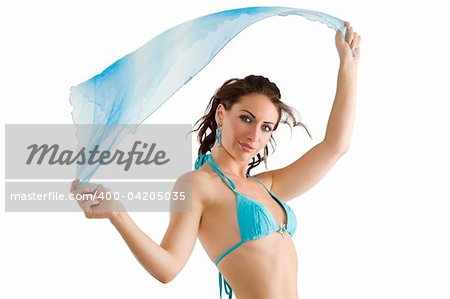 young and stunning brunette wearing a sky-blue swimsuit with scarf playing with wind