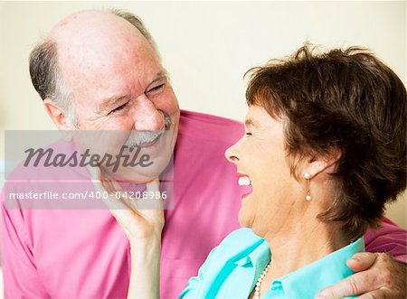 Beautiful senior couple in love, sharing a laugh together.