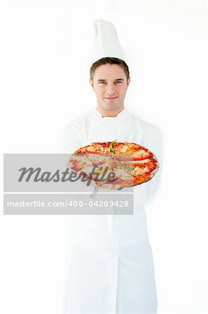 Young male cook smell at pizza with closed eyes against white background