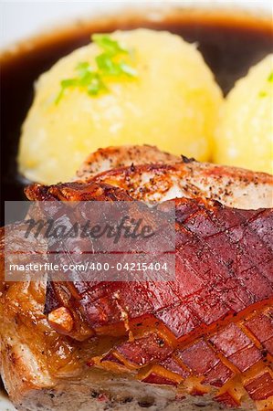 bavarian roast pork dish with potato dumplings