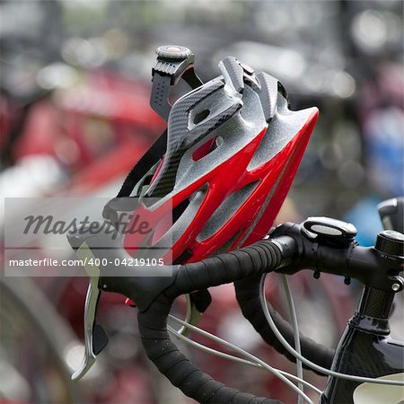 Red helmet resting on handlebars