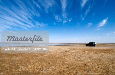 Lake in the Sahara desert with a off-road 4wd car - Near Merzouga - Best of Morocco