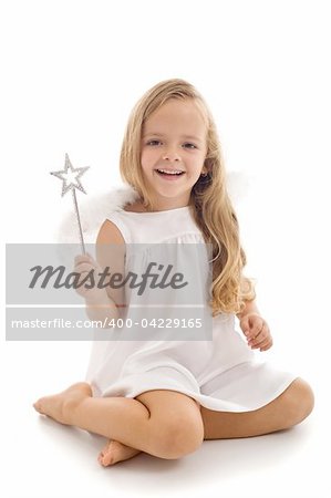 Little happy fairy or angel with magic wand sitting - isolated