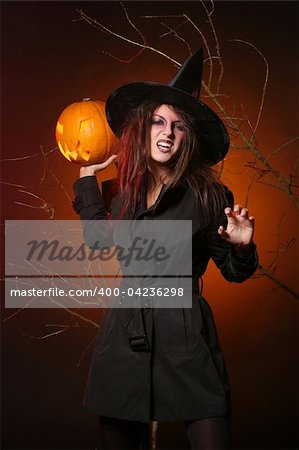 a beautiful woman with a pumpkin