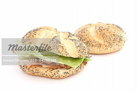 Sandwich made of bun with ham and lettuce on white background